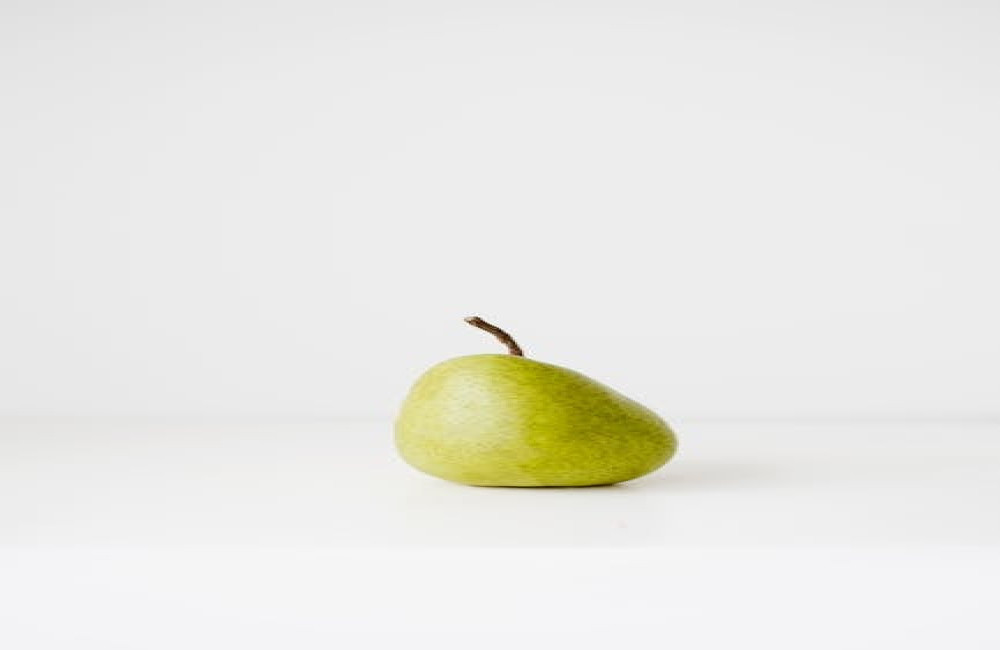 Wat betekent ‘met de gebakken peren zitten’ en waar komt het vandaan?